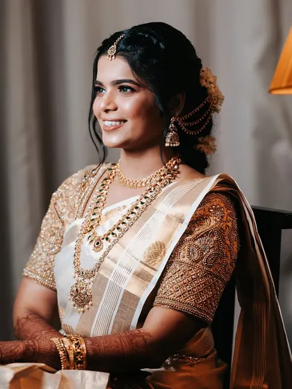 A smiling portrait of the bride. Her genuine happiness shines through, making this one of the most precious memories of her wedding day.