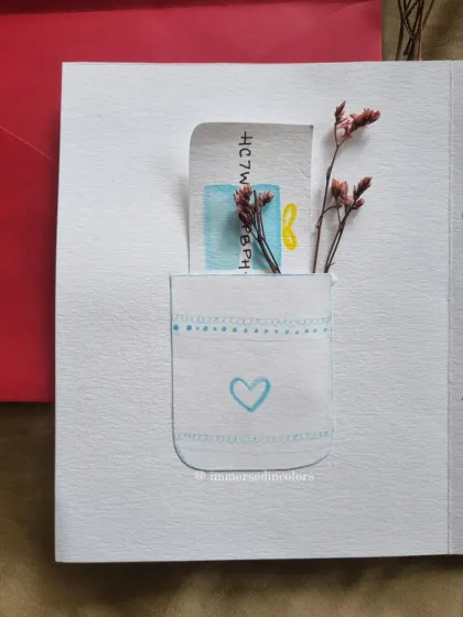 The inside of the puzzle-themed card features a small, hand-painted pocket, perfect for tucking in a personal note or a gift card.