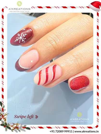 This mixed-design Christmas manicure includes a glittery red nail with a snowflake, a French tip, and a fun candy cane swirl pattern.