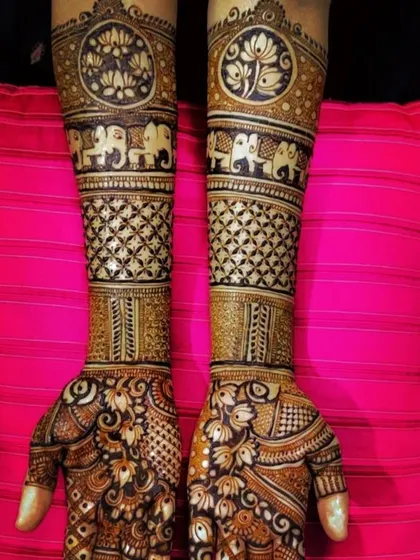A design that uses negative space to make the motifs stand out. The dark-filled lotus and elephant bands contrast beautifully with the lighter, more intricate patterns.