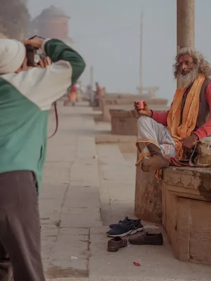 A series of portraits and street scenes from the ghats and alleyways of Varanasi. They feature locals, pilgrims, animals, and the photographer himself, painting a rich picture of daily life.