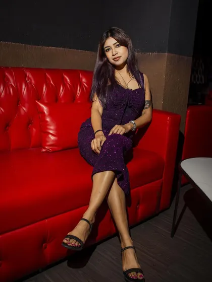 Relaxing on the iconic red sofa at the club in Bahrain. It was a great night of music and meeting new people.