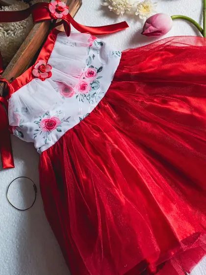 A different angle of the red and white floral tulle dress, showcasing its vibrant color and beautiful construction.