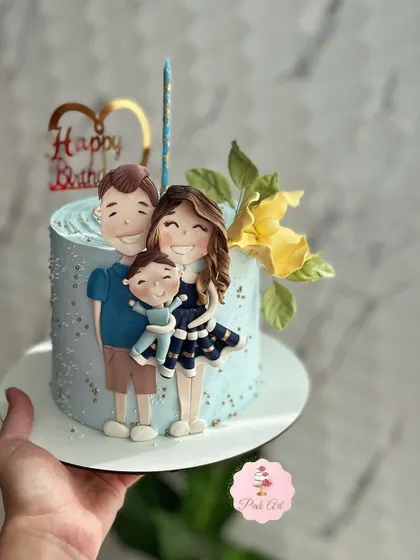 A heartwarming cake featuring a custom fondant family portrait.