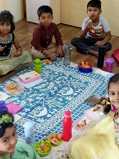 Children enjoying a festive meal together during our Ugadi celebration.