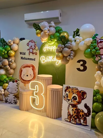 A closer look at the details in our modern jungle theme, including the layered backdrop panels and the cute cartoon animal characters placed on pedestals.