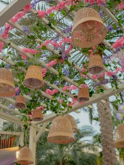 A closer look at the hanging basket details, a key element in creating the whimsical, garden-party feel of a Bridgerton-themed event.