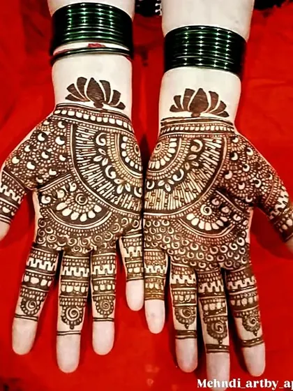 Mehendi is for everyone celebrating with you. This is a great example of an elegant design for family members or guests, focusing on a beautiful mandala and lotus pattern that covers the palm.