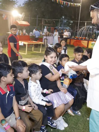 Kids gather around for an exciting science demonstration at an outdoor party. We make learning fun with safe, hands-on experiments that amaze and inspire curiosity.