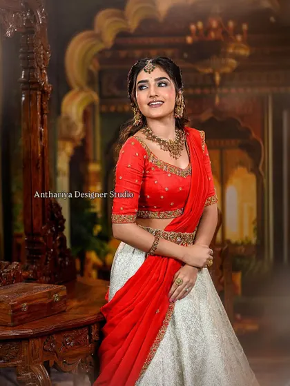 A stunning red and off-white lehenga with a pre-draped dupatta, perfect for a modern bride.