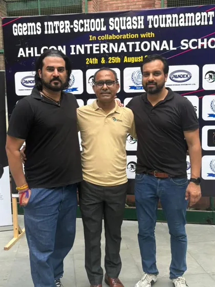 Posing with fellow coaches and organizers at the inter-school tournament. Collaboration is key to growing the sport at the grassroots level.