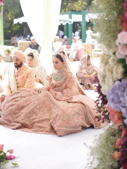 A serene moment from the Anand Karaj ceremony. The bride looks peaceful and radiant, surrounded by loved ones. It's a privilege to create a look that fits so seamlessly into these sacred moments.