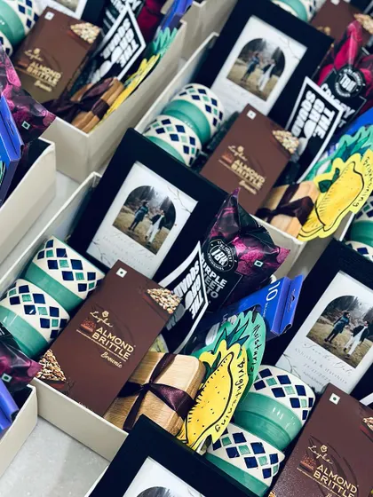 Our "Team Groom" hampers are the sweetest way to show your appreciation. This image shows the boxes filled to the brim with thoughtful gifts.