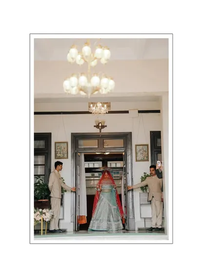 The bride's grand entrance through the doors of the palace. This shot is all about anticipation and creating a royal, fairytale-like moment.