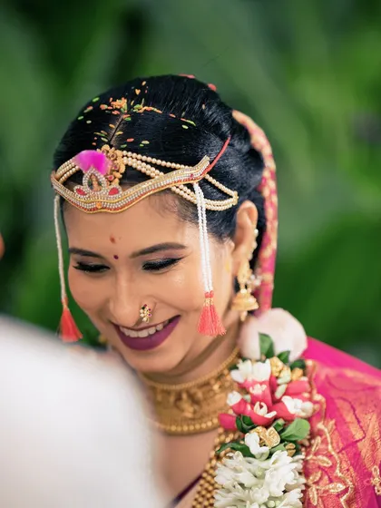 A joyful moment from Gopika's Muhurtham. Her smile says it all. The makeup is fresh, radiant, and perfectly suited for a day full of happiness.