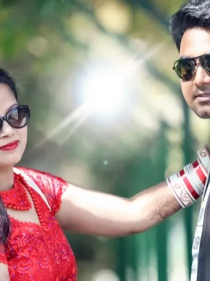 A cool, stylish couple portrait from a pre-wedding shoot, with the sun creating a nice flare effect.