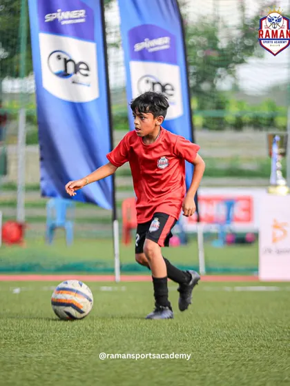 A player dribbles with focus and control during a competitive match.