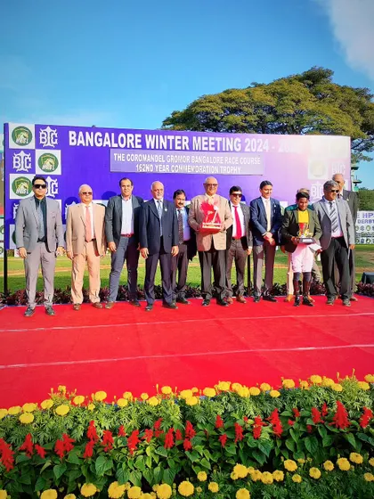 The winning team of Prana celebrates their victory in the commemoration trophy race.