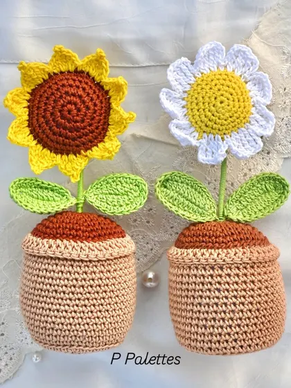 A perfect pair. Our crochet sunflower and daisy pots look so cheerful together and are perfect for brightening up your desk or a small shelf.