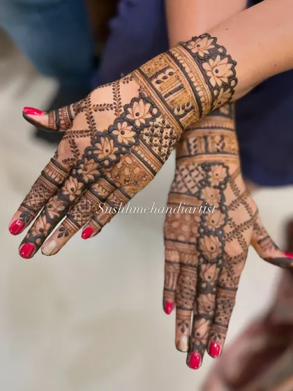 This design combines lotus motifs with intricate jaal (net) patterns. I love how the different elements come together to create a full and festive look.