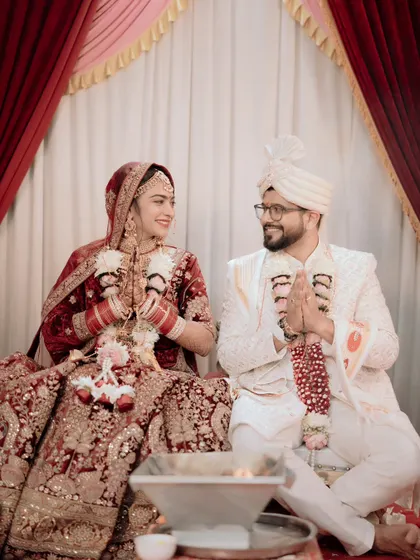 A candid moment of shared laughter during the wedding ceremony. This photo perfectly captures the joy and comfort the couple feels with each other.