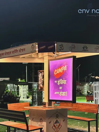 A close-up of our Smart Solar Hut at night in Ayodhya, with the Campa advertisement brightly lit. The design ensures that brand messages are prominent and eye-catching, even in crowded public spaces after dark.