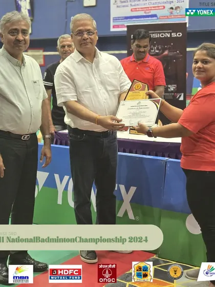 A female team member being felicitated for her role in the successful management of the national tournament. I am proud to have a diverse and capable team.