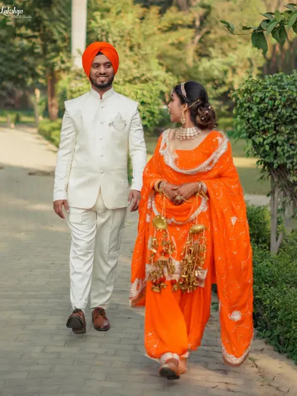 The couple taking a stroll in the park. This walking shot has a lovely, natural sense of movement and captures their easy-going chemistry.