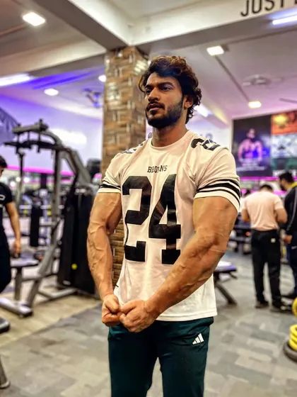 A strong pose showing my arm and chest size.