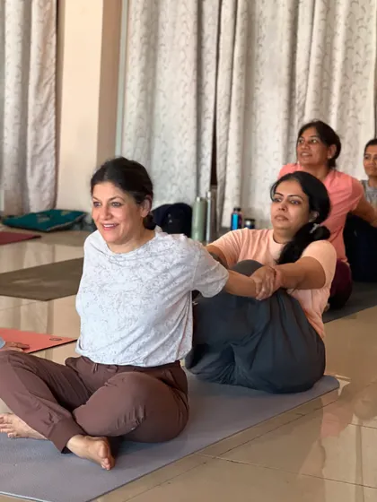 The joy of partner yoga is shared among students. This practice builds trust and connection within our sangha.