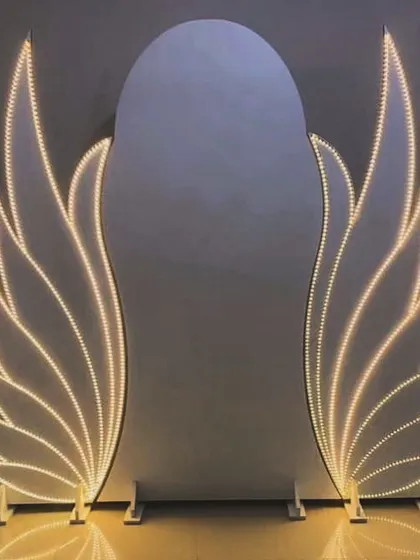 Another take on the angel wings concept, this backdrop features elegant, warm-white LED wings that provide a sophisticated and beautiful frame for photos.