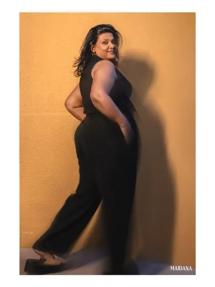 A shot from our official team photoshoot. I designed this all-black jumpsuit with a flattering silhouette to be both professional and stylish. I create custom jumpsuits and pantsuits for a modern work wardrobe.