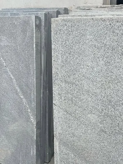 Slabs of grey granite, showing the natural grain and texture.