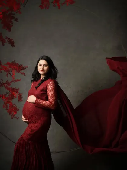 Here, I've added a subtle circular frame and floral elements to the composition, creating a fine art maternity portrait.