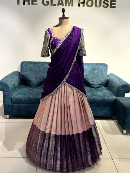 A customized lehenga in a beautiful combination of lavender, pink, and purple, with heavily embroidered sleeves.