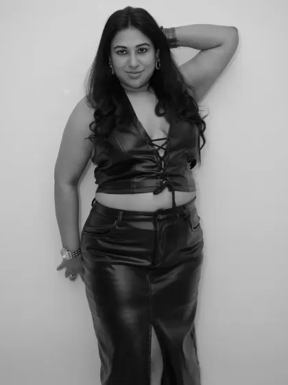 A classic black and white shot in a leather outfit. This photo captures the combination of charm, beauty, and music that defines my style.
