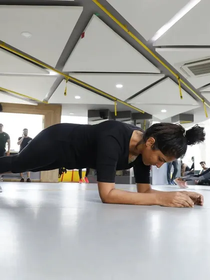 A participant holds a perfect plank during our gym-wide challenge. We host regular events like this to bring our members together, test their limits, and foster a sense of friendly competition.