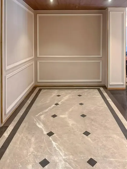 The pre-function area for the banquet hall in Bhopal. We used classic wall molding and patterned marble flooring to create an elegant space for guests to gather before an event.