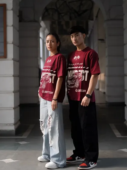 A shot featuring two models in matching graphic tees, perfect for a brand that offers unisex or coordinated clothing.