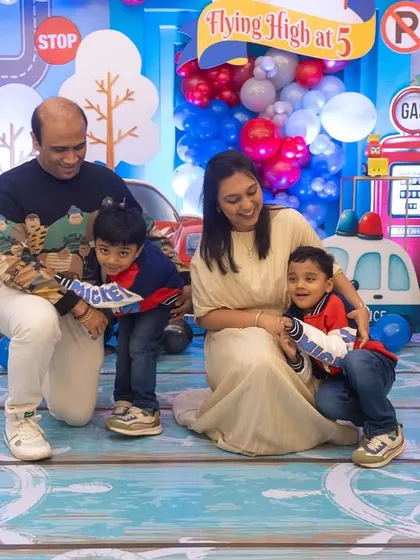 A happy family portrait from the travel-themed birthday party. It's a joy to create a backdrop for such special family moments.