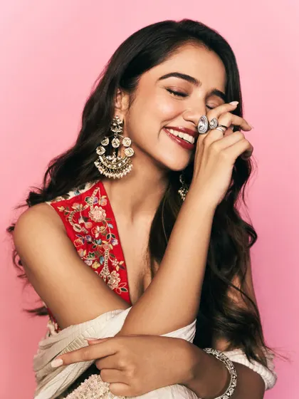 The joy of styling for major brand campaigns. This is a vibrant look for Ahsaas Channa for a Myntra shoot, featuring a modern ethnic sharara set with beautiful red floral embroidery and statement chandbali earrings.