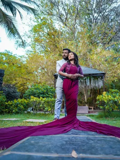 This deep purple gown with a long train adds a touch of royalty to this garden pre-wedding shoot. I styled both him and her for this elegant look.