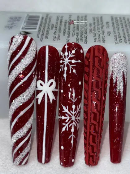 A slightly different angle of the red and white festive nails, highlighting the sparkling candy cane design.