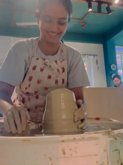 A student smiling with pride as she masters a large form on the wheel. This is the moment of triumph that makes all the practice worthwhile.