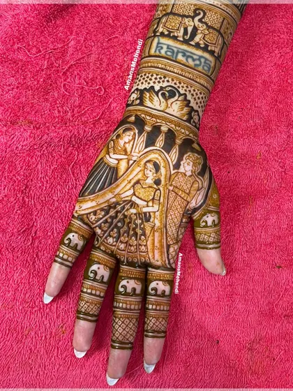 A beautiful bridal portrait featuring the varmala ceremony. The design also includes the word 'Karma' and small elephants on the fingers, adding personal and symbolic touches.