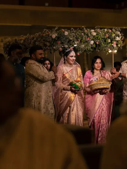 The bride's grand entrance, accompanied by her family, a moment filled with emotion and anticipation.