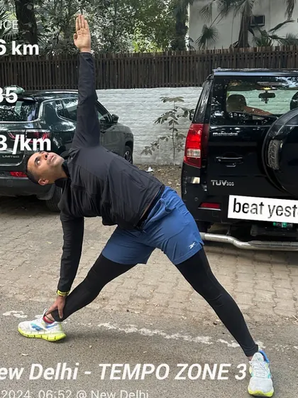 After a solid tempo run, I always make time for mobility work like this triangle pose to stretch and recover.