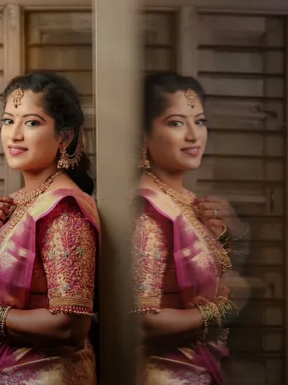 A similar creative portrait of a bride, using her reflection to create a symmetrical and artistic image.