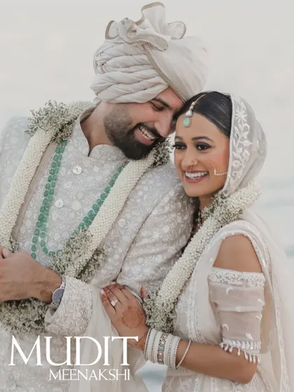 A joyful and candid portrait of a couple after their beach wedding ceremony in Thailand, full of smiles and love.