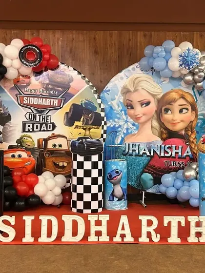 I can create unique combined themes for shared parties, like this "Cars" and "Frozen" setup for twins. Each side has its own distinct characters and color scheme, united by balloon arches and personalized name displays.